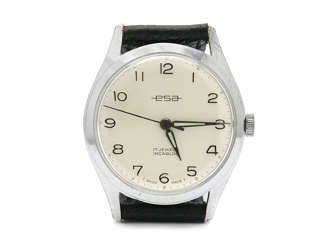 ESA, herrur, 33 mm, vitmetall, manuell, plexiglas, skadad urtavla, skadad boett, läderband, ca 1970. — Klockor/Övriga klockor — Kaplans