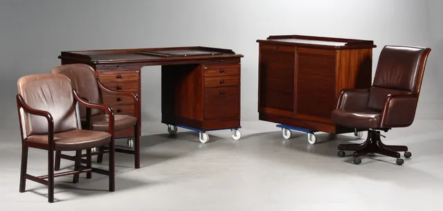 Andreas Hansen. Free-standing executive desk, double tambour door cabinet, office chair and a pair of armchairs (5)