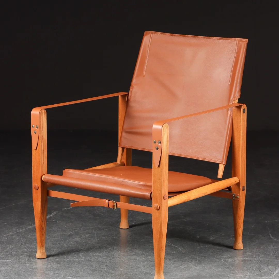 Kaare Klint. Safari chair upholstered in cognac colored aniline leather — Furniture/Lounge chairs — Lauritz