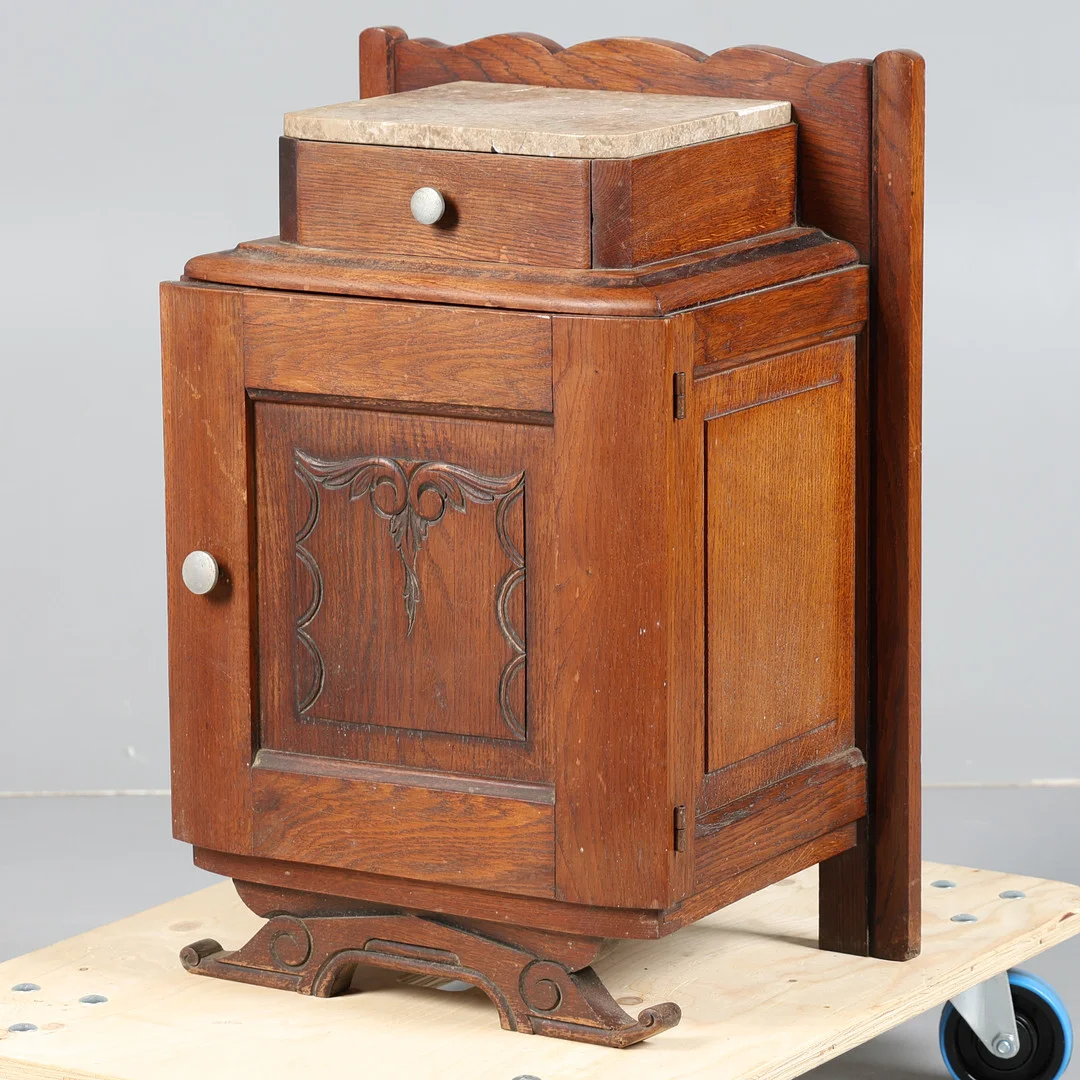 A 20TH CENTURY FRENCH OAK AND MARBLE BEDSIDE CUPBOARD. — Cupboards, Cabinets & Shelves — Bishop & Miller