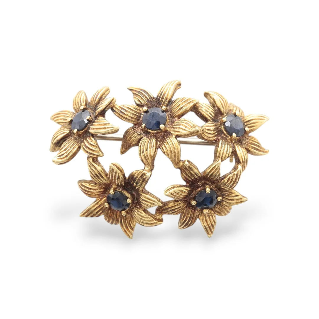 TIFFANY & CO. Gold and sapphires floral brooch, circa 1970. — Brooches & Pendants — Balclis