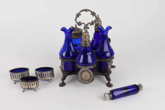 Plat de menage of silver, P. Hertz, Copenhagen 1896 with blue glass bottles and three salt pans