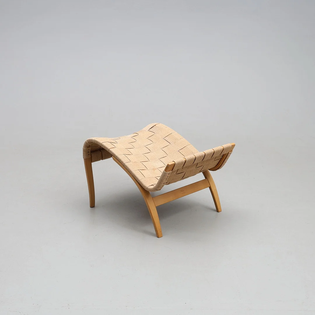 BRUNO MATHSSON. Fotpall, "Pernilla", Firma Karl Mathsson, 1968. — Armchairs & Chairs — Gomér & Andersson Jönköping