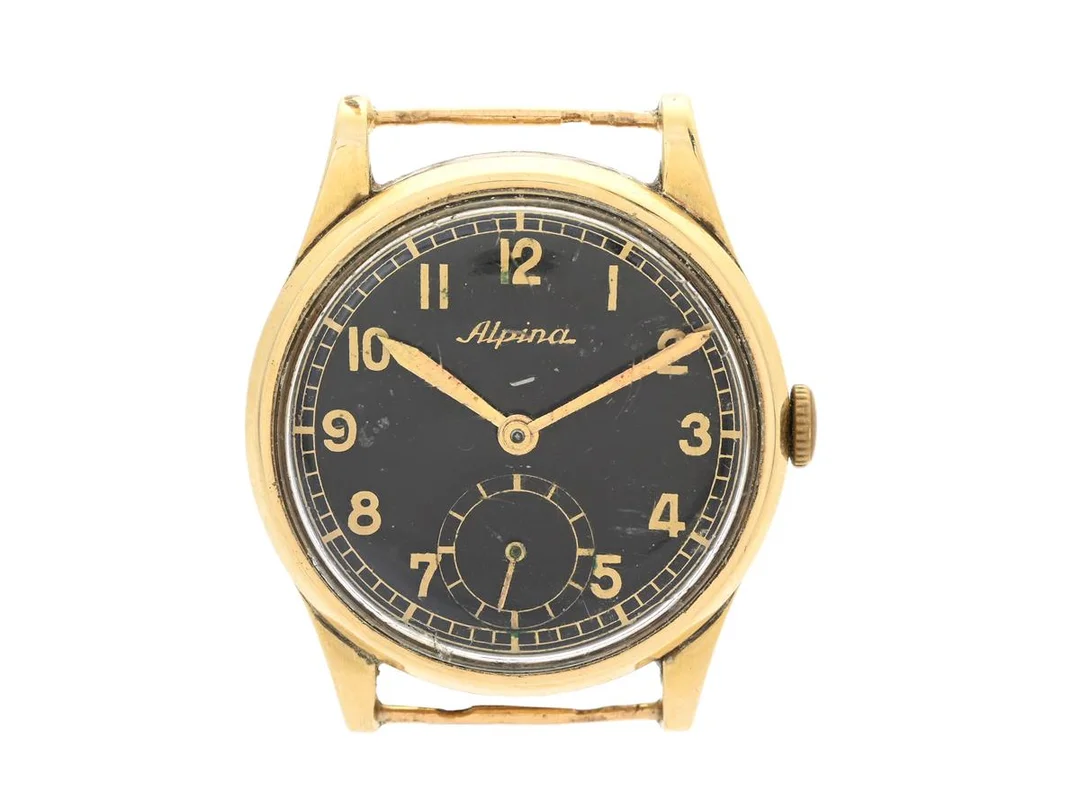 ALPINA, unisex, 28,5 mm, Cal 586, Verk nr. 1472, Boett nr. 111109, 14K guld, manuell, plexiglas, liten sekundvisare, skadad urtavla, defekt (går ej, akut servicebehov), fasta bandstift, ca 1945. — Klockor/Alpina — Kaplans
