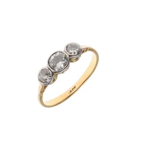 A DIAMOND THREE STONE RING.
