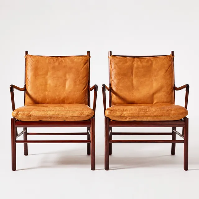 OLE WANSCHER. "Colonial Chair", karmstolar, ett par, Poul Jeppesens Møbelfabrik, Danmark, modellnr PJ 149, palisander, sits i flätad rotting, lösa dynor klädda i cognacsfärgat läder.