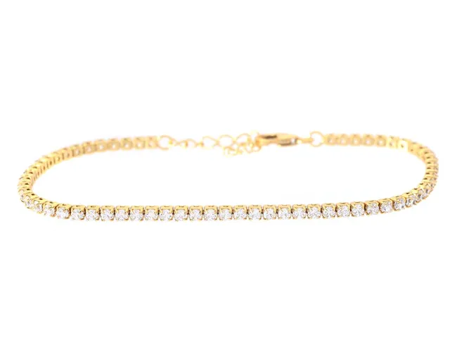 TENNISARMBAND, förgyllt sterlingsilver, cubic zirconia, längd 15 - 18 cm, vikt ca 2,9 g.