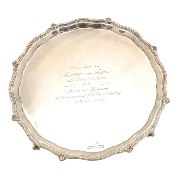A LATE VICTORIAN SILVER SALVER.