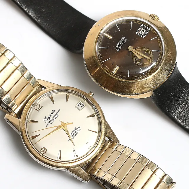 ARMBANDSUR, 2 st. bl.a. guld på stål, "Calendar Goldomatic", Lagonada. 1960-tal.