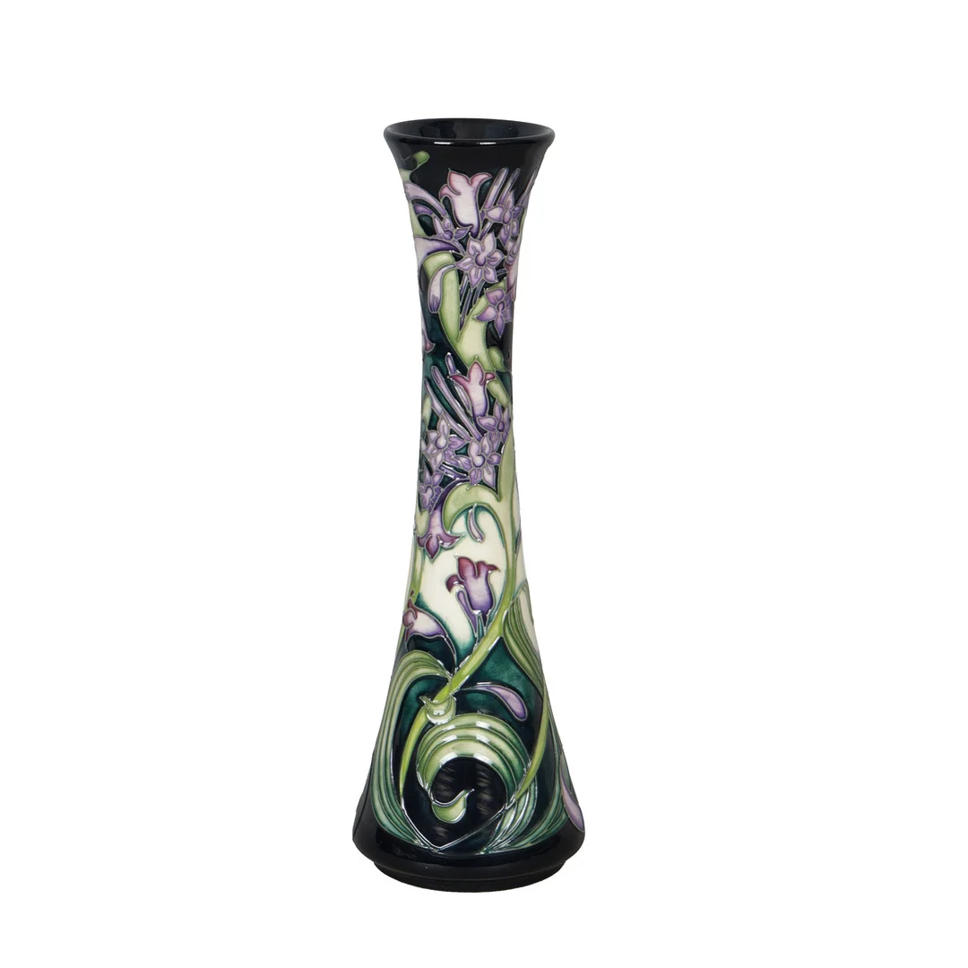 A MOORCROFT VASE IN THE ISIS PATTERN ON BLUE GROUND, BY EMMA BOSSONS, 2003. — European — Bishop & Miller