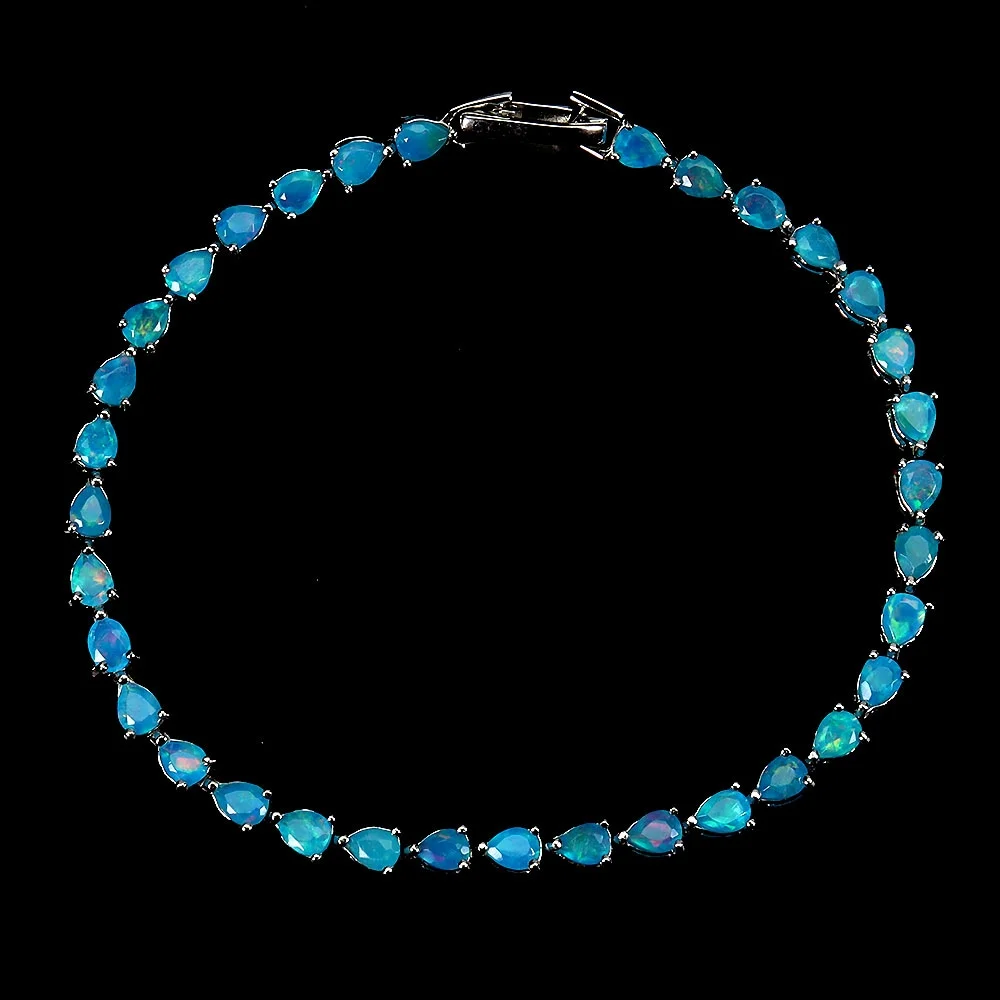 Bracelet in rhodium-plated Sterling silver with numerous faceted blue opals — Jewellery/Bracelets — Lauritz