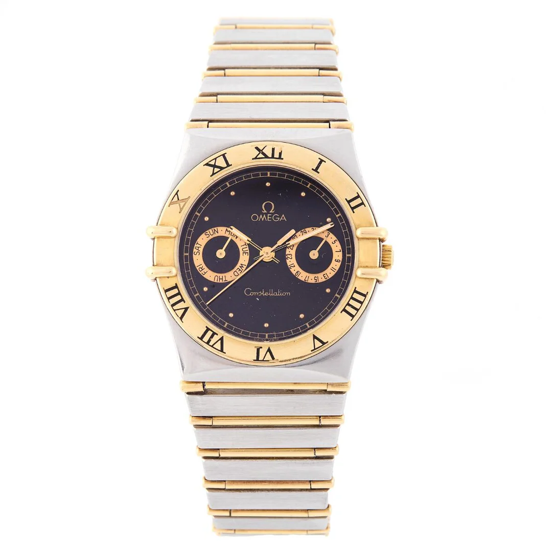 Constellation Date of 18k gold and steel, ref. 345.1070. Quartz movement with automatic winding, date indication and day indication, cal. 1445. Omega bracelet of 18k gold and steel with fold-over clasp. Circumference approximately 18 cm. Ø 32 mm. 1980s. — Clocks & watches/Wristwatches — Bruun Rasmussen