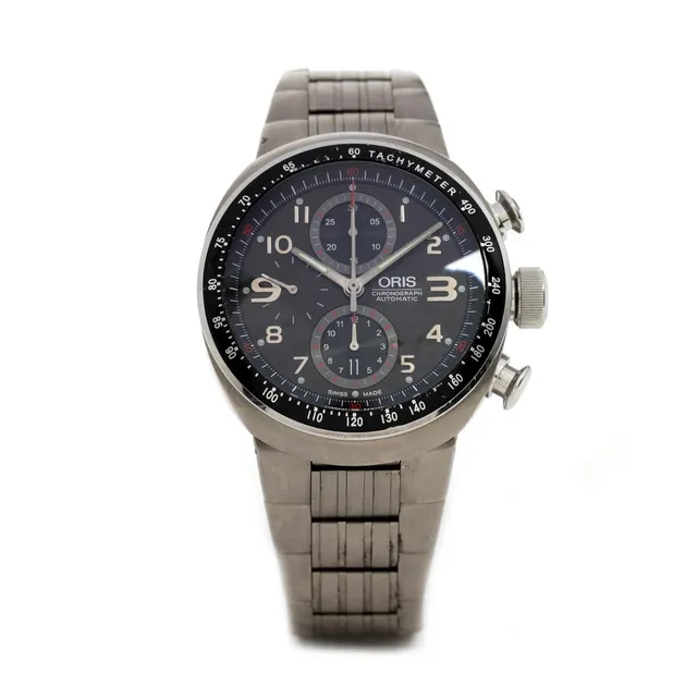 Wristwatch of titanium, ref. 7587–72. Mechanical movement with automatic winding and chronograph and date indication, cal. 674.25. Bracelet of titanium. Circumference app. 22 cm. Ø 43 mm.