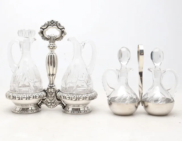 Two silvery metal cruets stands with carved glass containers, mid 20th Century.