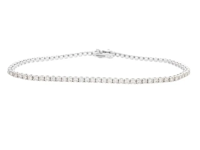 TENNISARMBAND, 18K vitguld, 78 briljantslipade diamanter ca 1,96 ctv, ca TW-TCa/VS-SI, längd 17 cm, vikt 6,5 g.