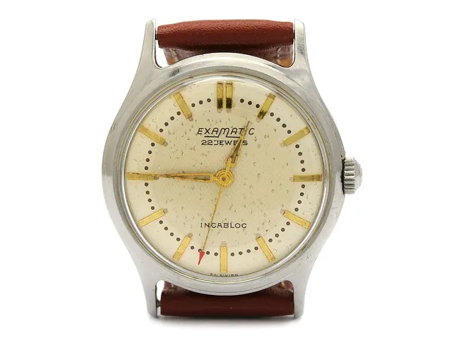 EXAMATIC, herrur, 32,5 mm, vitmetall, automatisk, plexiglas, skadad urtavla, läderband, ca 1960.