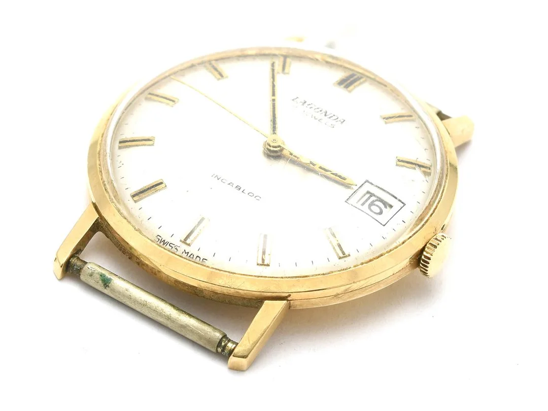 Lagonda, 18K, brv 23,3g, 35mm, manuell, 17 juveler, incabloc, Snr: 7819, datum, plexiglas, saknar armband — Klockor/Lagonda — Kaplans