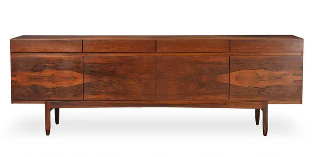 A rosewood sideboard, front with four drawers and four doors, inside with shelves and trays. Model FA 66. Manufactured by Faarup Møbelfabrik. H. 77. W. 230. D. 50 cm.