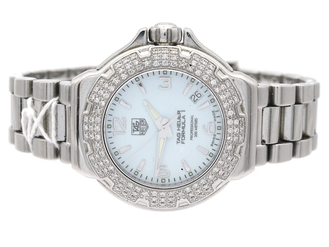 TAG HEUER, Formula 1 Lady, Professional, i stål, quartz, safirglas, 200 Meter, Serie nr. REA2230 Boett nr. WAC1215-0, damur, 36 mm, med box och extra länkar, med datum och diamantring, batteribyte behövs, — Klockor/Heuer — Kaplans