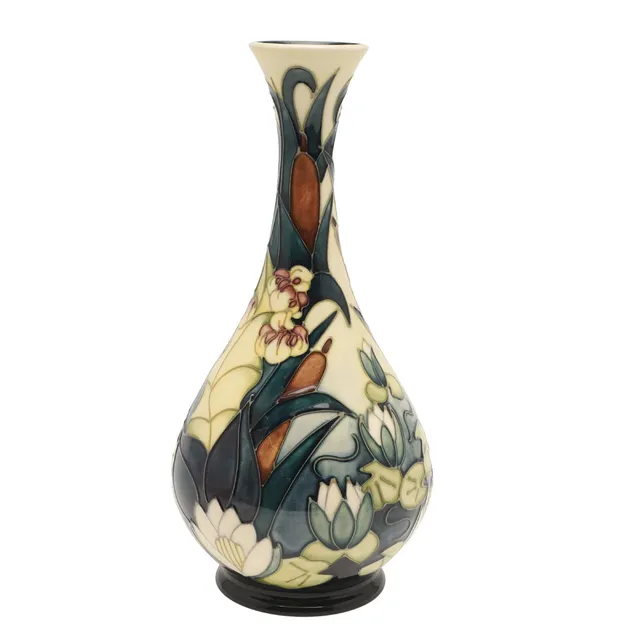 A MODERN MOORCROFT BULLRUSH AND WATERLILY PATTERN VASE.