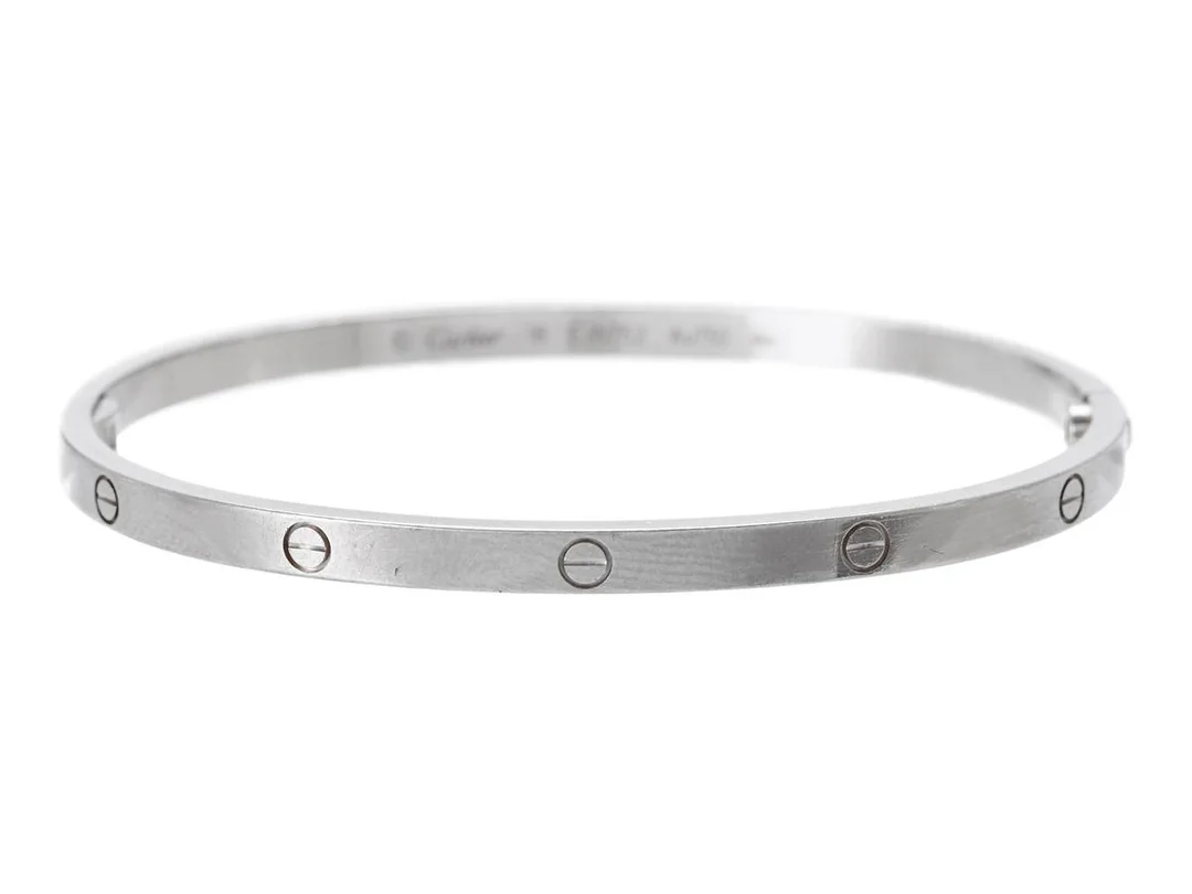 CARTIER, Love armband, liten modell, 18K vitguld, serienr EJN752, stl 18, vikt 21,8 g, slitage, skadat och glappt gångjärn, se fördjupad information. — Smycken/Armband — Kaplans