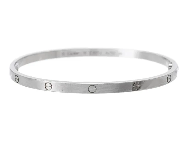 CARTIER, Love armband, liten modell, 18K vitguld, serienr EJN752, stl 18, vikt 21,8 g, slitage, skadat och glappt gångjärn, se fördjupad information.