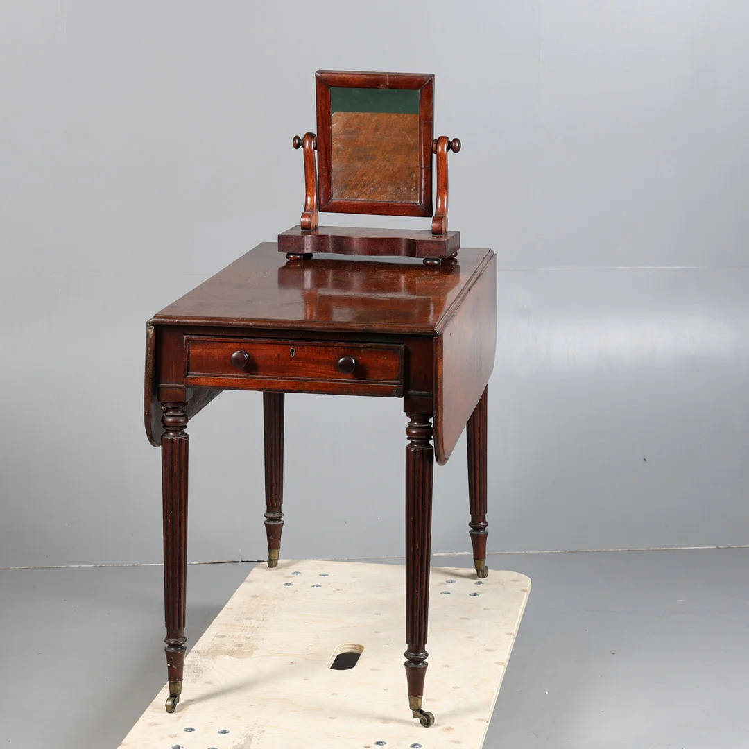 A 19TH CENTURY MAHOGANY PEMBROKE TABLE AND A VICTORIAN SWING MIRROR (2). — Tables — Bishop & Miller