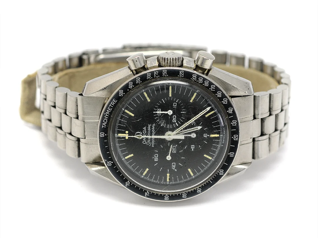 OMEGA, Speedmaster, Professional, "Tachymetre", Cal 861, Serie nr. 31313490, Ref nr. ST 145.0022, Boett nr. 145.022 ST 71, kronograf, herrur, 42 mm, stål, manuell, plexiglas, skadad urtavla, skadad boett, originallänk (sliten), viklås, Ref nr. 1116/575, ca 1971. — Klockor/Omega — Kaplans