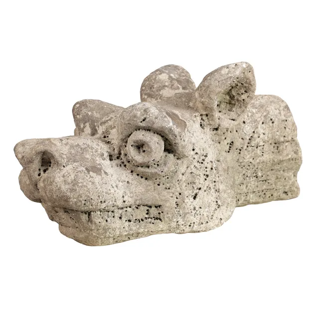 A RARE 17TH CENTURY CARVED 'TUFA' LIMESTONE OF A DRAGON'S HEAD.