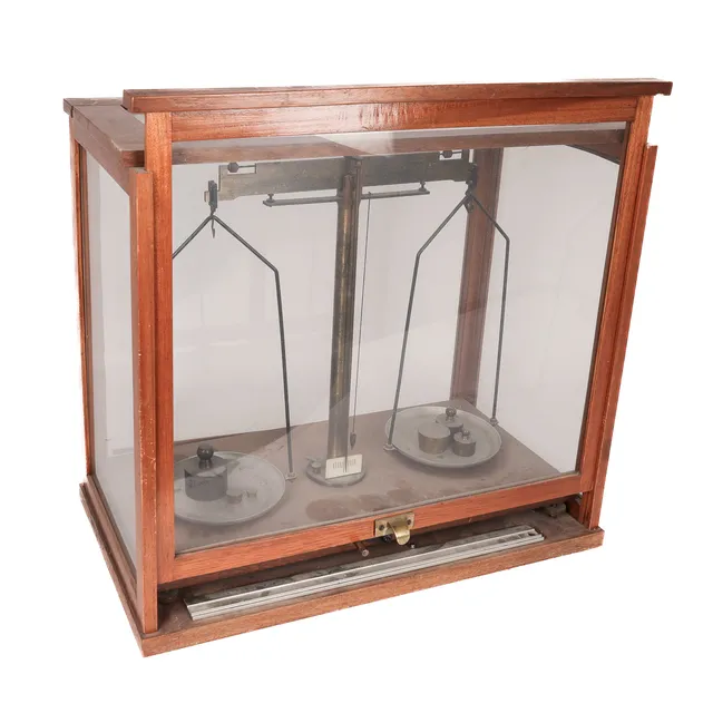 Pharmacist scale with weights in display case