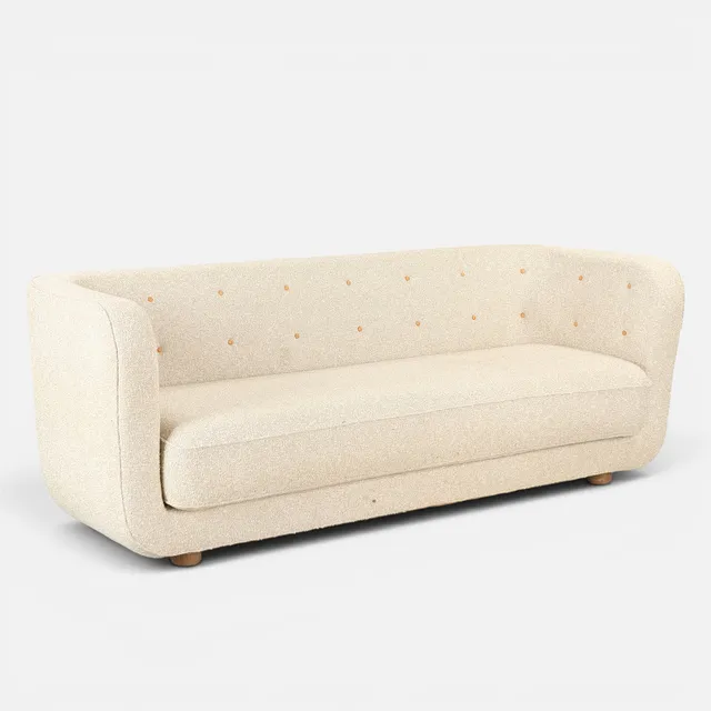 FLEMMING LASSEN. 'Vilhelm'. Sofa overpolstret med knapsyet uld Bouclé, formgivet i 1935.