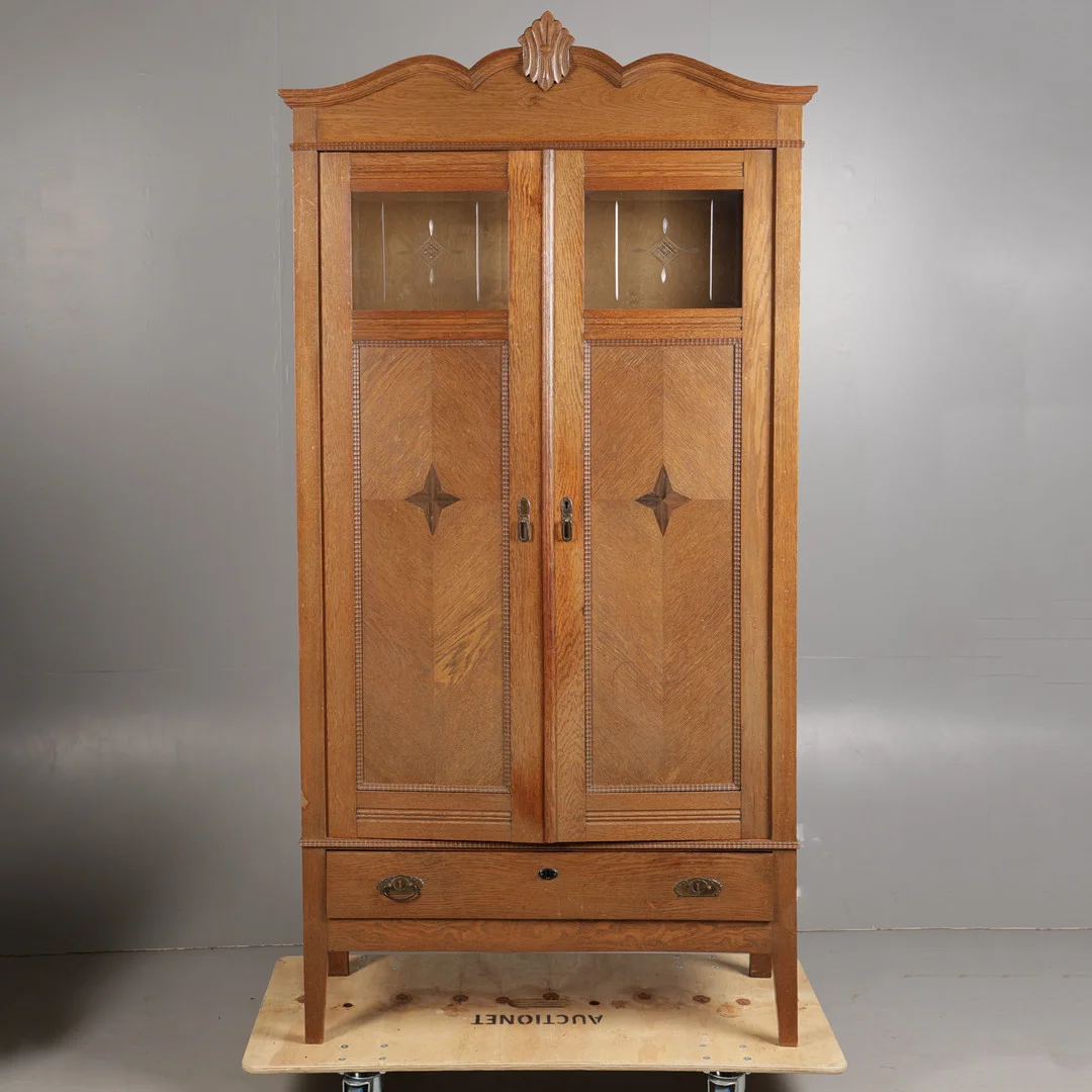 AN EARLY 20TH CENTURY OAK AND GLAZED CUPBOARD. — Cupboards, Cabinets & Shelves — Bishop & Miller