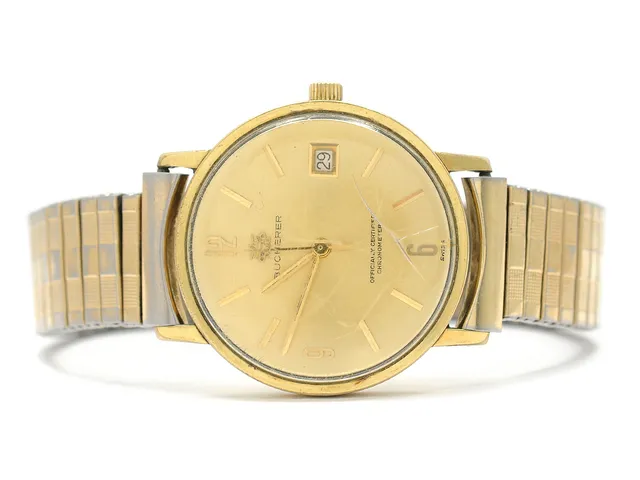 BUCHERER, herrur, 34 mm, doublé (20 micron), automatisk, plexiglas, datum, skadad urtavla, skadad boett, ca 1962, metallänk ej original.