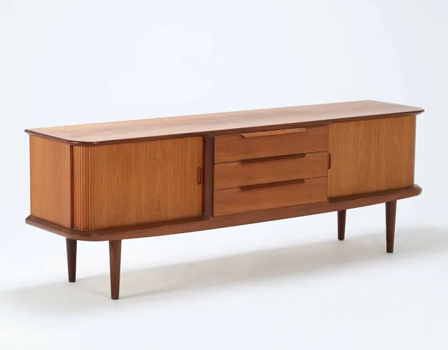 Danish furniture design. Low teak sideboard on a low plinth from the 1960s.