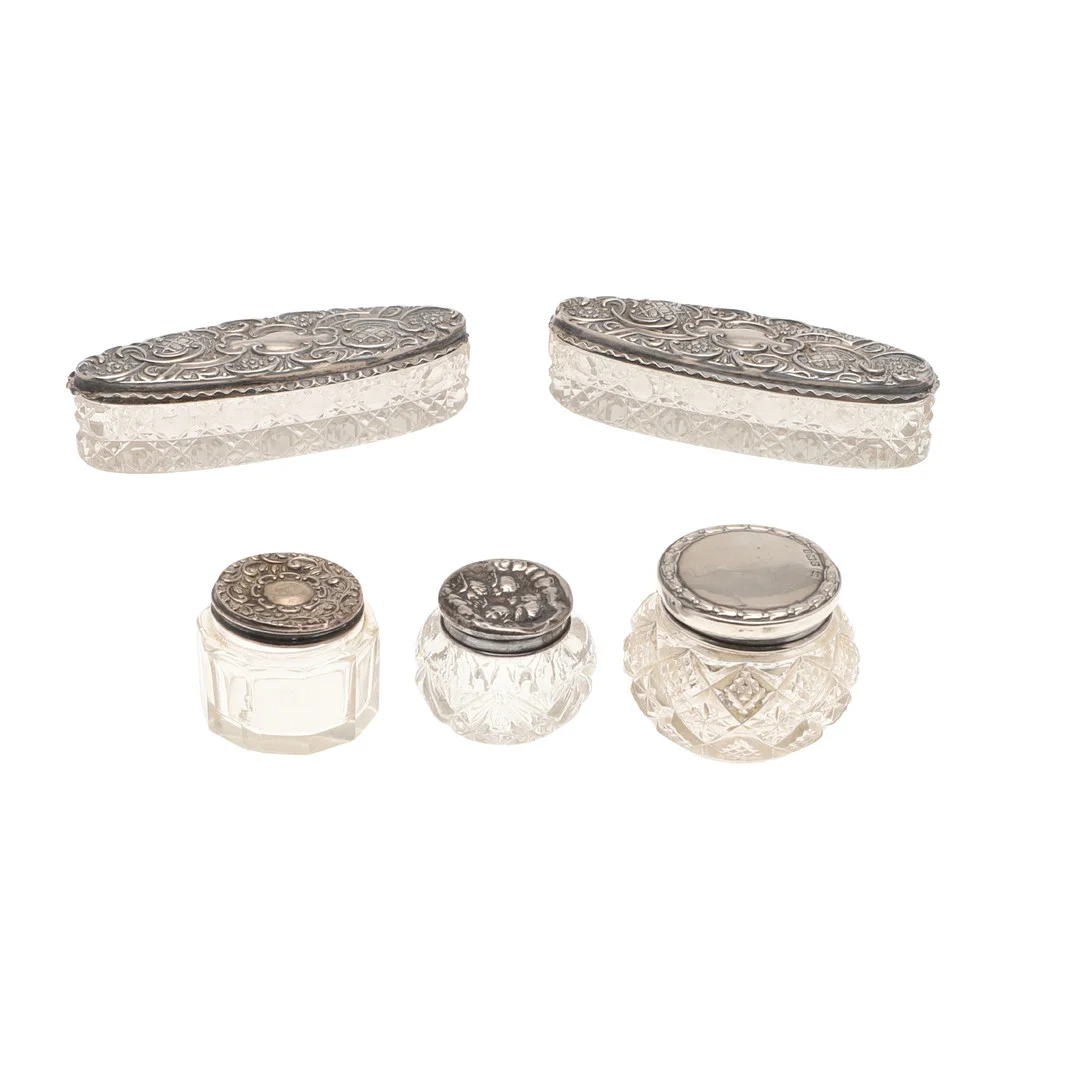 FIVE SILVER LIDDED CUT GLASS DRESSING TABLE JARS. — Silver — Lawrences Auctioneers