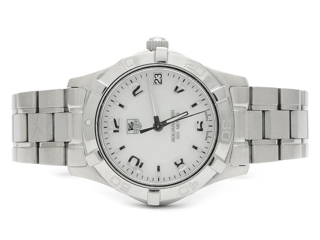 TAG HEUER, Aquaracer (300 Meters), Serie nr. EAB1221, Ref nr. WAF1311.BA0817, damur, 32 mm, stål, quartz, safirglas, datum, pärlemorurtavla, originallänk, viklås, Ref nr. FAA035-G-B9/3128 -G, cert, augusti 2013, box, ytterkartong. — Klockor/Tag Heuer — Kaplans