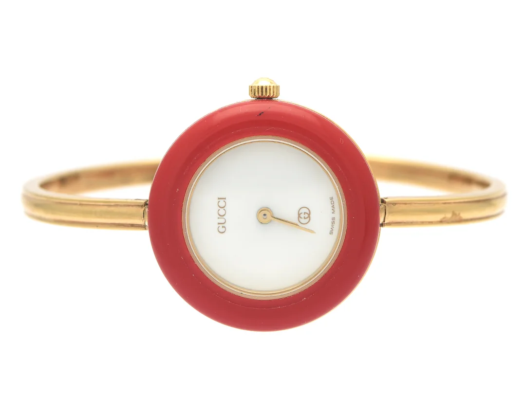 GUCCI, damur, 26 mm, Serie nr. 0269020, Boett nr. 1100-L, doublé, quartz, mineralglas, defekt, 12 st. utbytbara ringar, integrerad originallänk, längd 155-160 mm, ca 1995, box, ytterkartong. — Klockor/Gucci — Kaplans