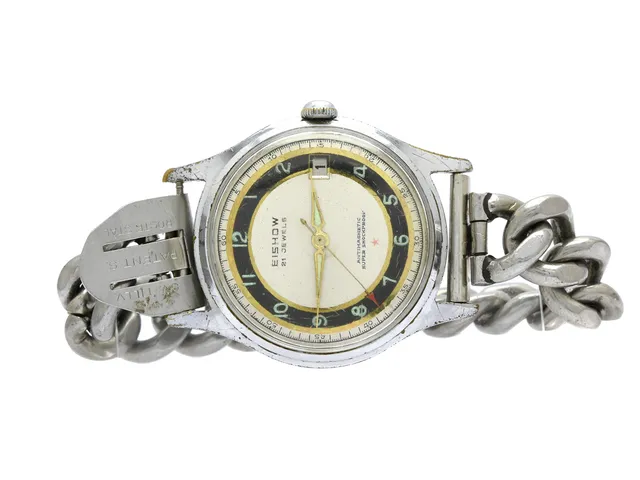 EISHOW, Antimagnetic, herrur, 34 mm, vitmetall, manuell, plexiglas, datum, skadad urtavla, skadad boett, ca 1960, metallänk ej original.