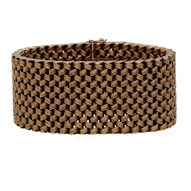 Gold wide bracelet, circa 1960.