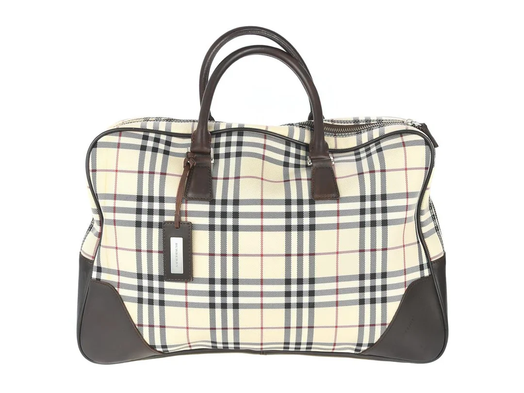 VÄSKA, BURBERRY, beigerutigt tyg, mörkbrunt läder, 42x29x10 cm, fläckar. — Accessoarer/Väskor — Kaplans