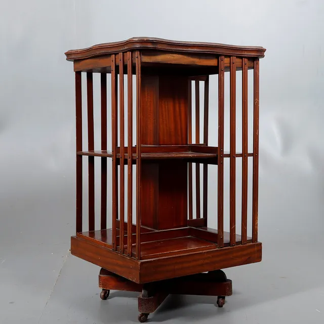 English swivel bookcase with marquetry top, 20th Century.
