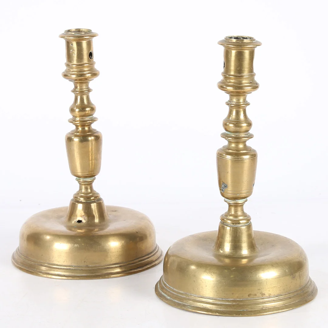 A NEAR PAIR OF 17TH CENTURY BRASS CANDLESTICKS, FLEMISH. — Pewter, Brass & Copper — Bishop & Miller