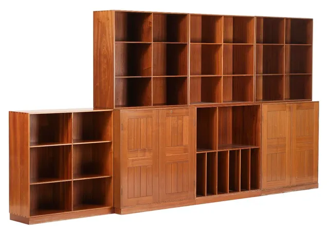 Two solid mahogany cabinets, five bookcases and four plinth. Made and partly marked by Rud. Rasmussen cabinetmakers. H. 76. W. 76. D. 36 and H. 76. W. 76. D. 27.5 cm. (11)