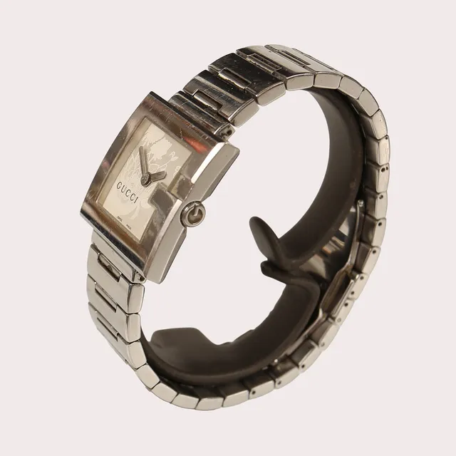 GUCCI "G" armbandsur, stålboett och länk, urtavla med blomstermotiv. Quartz. Omkring 2000-tal.