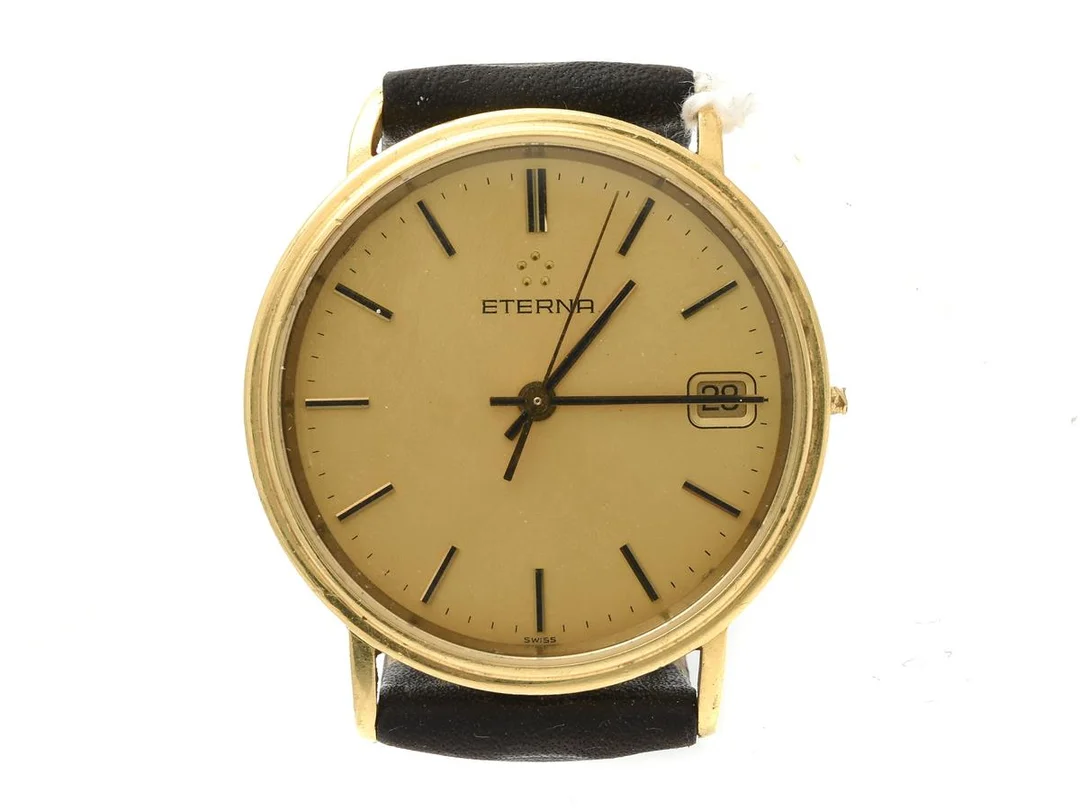 Eterna 18K Ø32mm, quartz, datum, defekt (saknar krona), böjt horn, slitet läderarmband — Klockor/Eterna — Kaplans