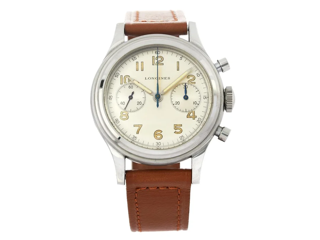 LONGINES, kronograf (Flyback), Cal 13 ZN, Serie nr. 7309361, Ref nr. 5415, Boett nr. 23485 / 15, herrur, 37 mm, stål, manuell, plexiglas, visare i stål, läderband, "Extract from the Archives", levererad till den svenska och norska agenten Hausammann 17/5 1949. — Klockor/Longines — Kaplans
