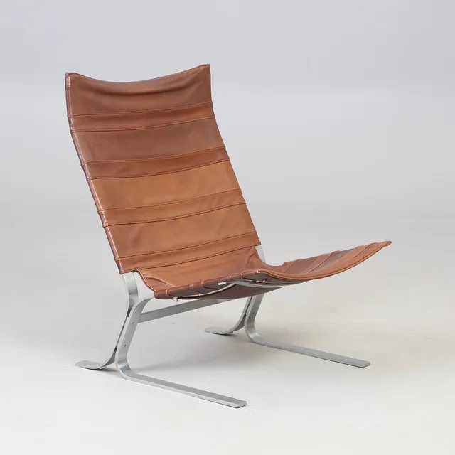 SKANDINAVISK DESIGN. Loungestol / lænestol af stål og læder, 1960'erne.