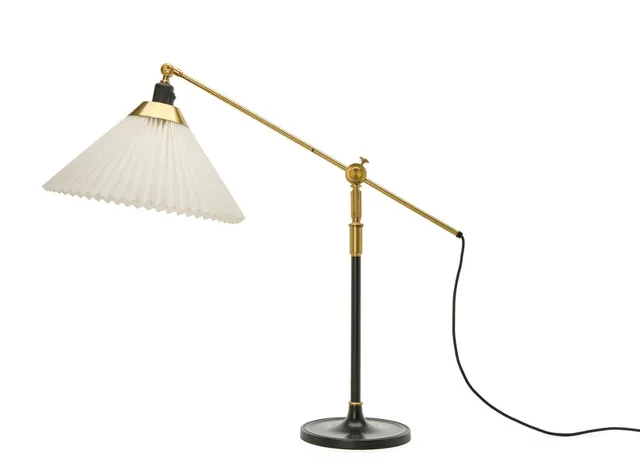 Telescope table lamp of black lacquered metal and brass. Adjustable arm for loose shade of pleated acrylic. Model 338. Made by Le Klint.