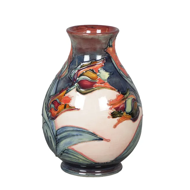 A MOORCROFT RED TULIP POTTERY VASE.