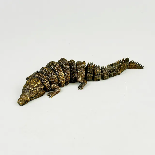 BRONZE ARTICULATED CROCODILE.